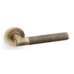Alexander & Wilks AW220AB Spitfire Knurled Lever On Round Rose - Antique Brass (LEAD TIME: 2-3 DAYS)
